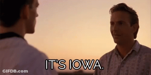 Two Men Are Standing Next To Each Other In Front Of A Sunset And Talking . GIF