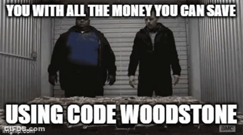 Two Men Are Standing Next To Each Other In Front Of A Table Filled With Money . GIF
