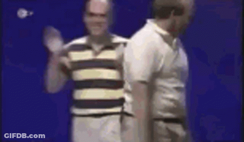 Two Men Are Standing Next To Each Other On A Blue Background . GIF