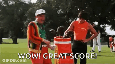 Two Men Are Standing Next To Each Other On A Golf Course And One Of Them Is Holding A Golf Bag . GIF