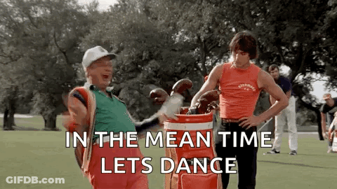 Two Men Are Standing Next To Each Other On A Golf Course Holding Golf Clubs And A Golf Bag . GIF