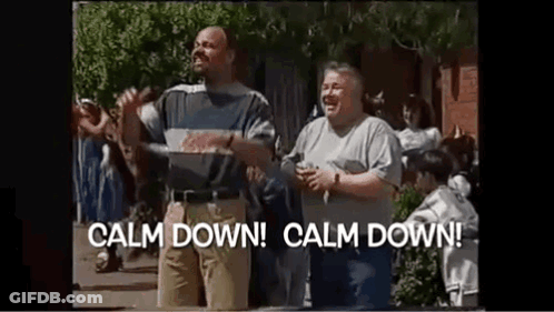 Two Men Are Standing Next To Each Other On A Street In Front Of A Crowd Of People . GIF