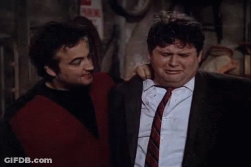 Two Men Are Standing Next To Each Other , One Is Holding A Can Of Beer And The Other Is Crying . GIF
