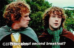 Two Men Are Standing Next To Each Other Talking About Second Breakfast GIF