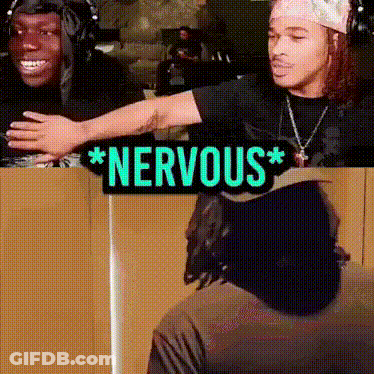Two Men Are Standing Next To Each Other With A Sign That Says * Nervous * GIF