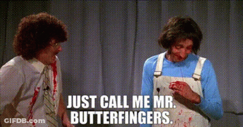 Two Men Are Standing Next To Each Other With Blood On Their Faces And One Of Them Is Holding A Knife . GIF