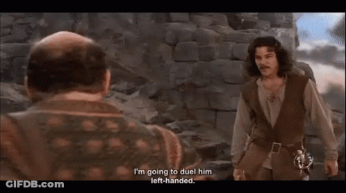 Two Men Are Standing Next To Each Other With One Saying I 'M Going To Duel Him Left Handed . GIF