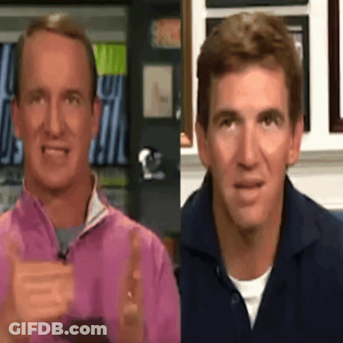 Two Men Are Standing Next To Each Other With One Wearing A Pink Jacket GIF