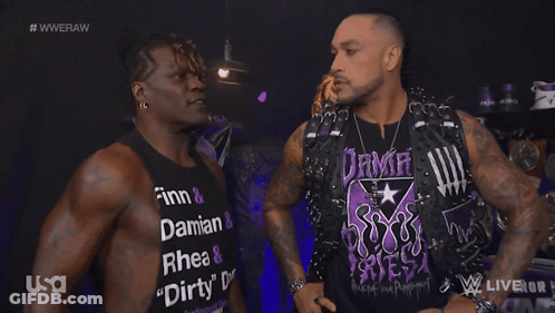 Two Men Are Standing Next To Each Other With One Wearing A Shirt That Says Dirty GIF