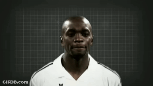 Two Men Are Standing Next To Each Other With One Wearing A White Adidas Shirt GIF