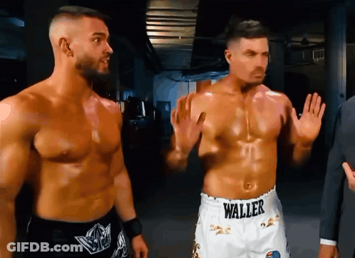 Two Men Are Standing Next To Each Other With One Wearing Shorts That Say Waller On Them GIF