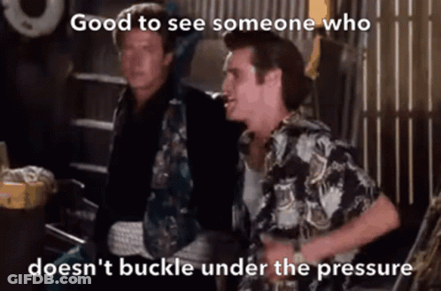 Two Men Are Standing Next To Each Other With The Caption " Good To See Someone Who Doesn 'T Buckle Under The Pressure " GIF