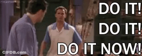 Two Men Are Standing Next To Each Other With The Words `` Do It ! Do It ! Do It Now ! '' . GIF
