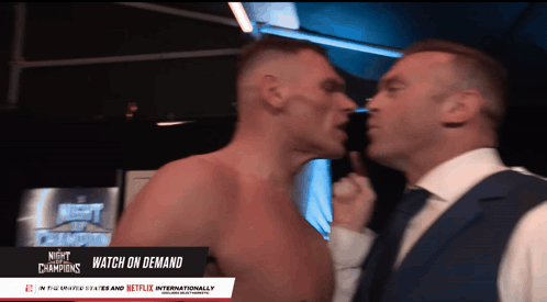 Two Men Are Standing Next To Each Other With The Words Night Of The Champions In The Upper Left Corner GIF