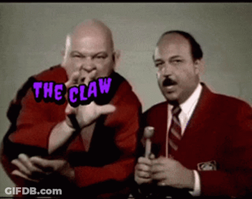 Two Men Are Standing Next To Each Other With The Words The Claw Written Above Them GIF