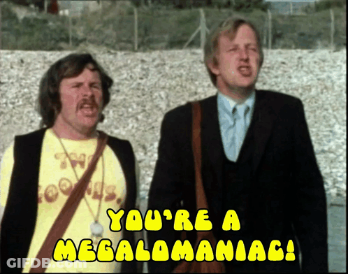 Two Men Are Standing Next To Each Other With The Words " You 'Re A Megalomaniac " On The Bottom GIF