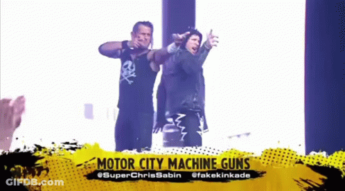 Two Men Are Standing Next To Each Other With Their Arms Outstretched And The Words Motor City Machine Guns Above Them . GIF