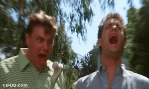 Two Men Are Standing Next To Each Other With Their Mouths Open And One Is Screaming . GIF