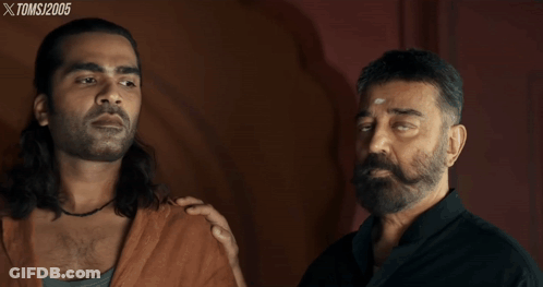 Two Men Are Standing Next To Each Other With Xtoms 2005 Written On The Bottom Right GIF