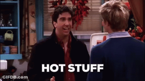 Two Men Are Talking In A Kitchen And One Of Them Is Saying Hot Stuff GIF