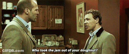 Two Men Are Talking In A Kitchen And One Of Them Says Who Took The Jam Out Of Your Doughnut . GIF