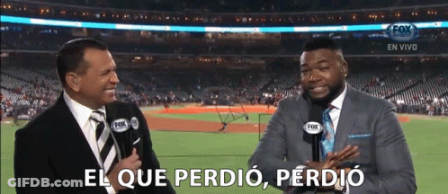 Two Men Are Talking In Front Of A Baseball Field And One Of Them Says El Que Perdió GIF