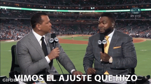Two Men Are Talking In Front Of A Fox Sports Stadium GIF