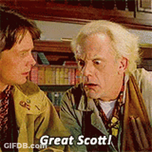 Two Men Are Talking To Each Other And One Of Them Is Saying Great Scott GIF