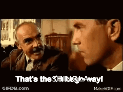 Two Men Are Talking To Each Other And One Of Them Is Saying `` That 'S The Shingo Away '' . GIF