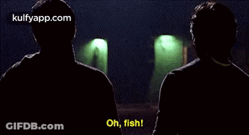 Two Men Are Talking To Each Other In A Dark Room And One Of Them Is Saying `` Oh , Fish '' . GIF