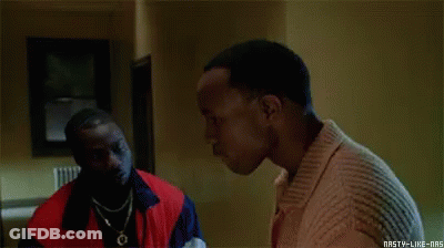 Two Men Are Talking To Each Other In A Room In A Movie . GIF