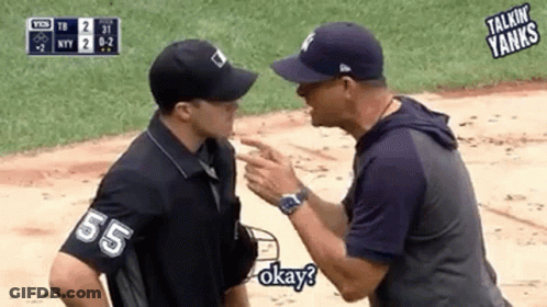 Two Men Are Talking To Each Other On A Baseball Field And One Of Them Is Wearing A Shirt With The Number 55 On It . GIF