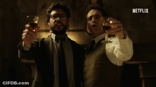 Two Men Are Toasting With Wine Glasses And The Word Netflix Is Visible In The Corner GIF