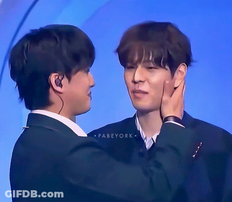 Two Men Are Touching Each Other 'S Faces And The Words Pabeyork Are On The Bottom GIF