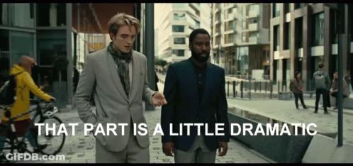 Two Men Are Walking Down A Street With The Words That Part Is A Little Dramatic Behind Them GIF