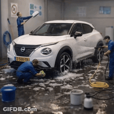 Two Men Are Washing A White Nissan With A License Plate Z-588-Fr GIF