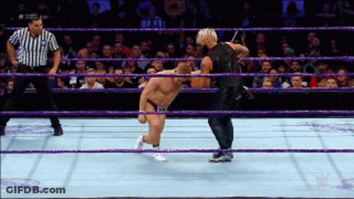 Two Men Are Wrestling In A Ring With A Referee And The Words N Steel King On The Bottom GIF