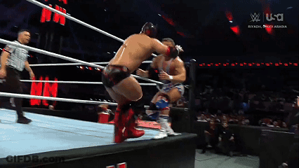 Two Men Are Wrestling In A Ring With A Sign That Says U.s.a. GIF