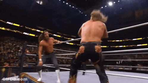 Two Men Are Wrestling In A Ring With The Word Full On The Stands GIF