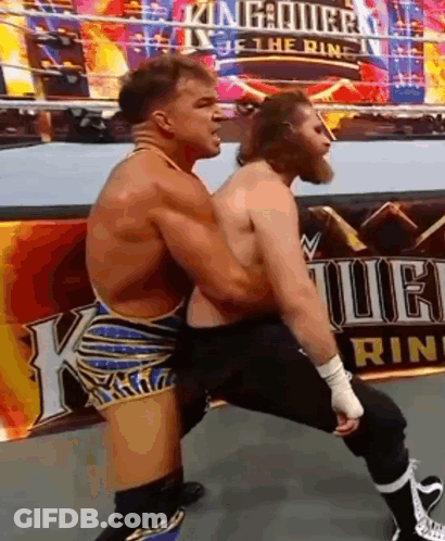 Two Men Are Wrestling In A Wrestling Ring With A Sign In The Background That Says King Of The Ring . GIF