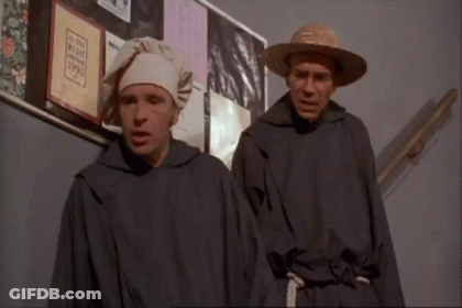 Two Men At Bulletin Board With Man In Hat GIF
