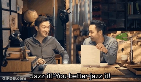 Two Men At Desk One Says Jazz It GIF