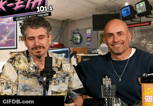 Two Men At Microphone With 101.1 Sign GIF