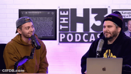 Two Men At Microphones In Front Of The H3 Podcast Sign GIF