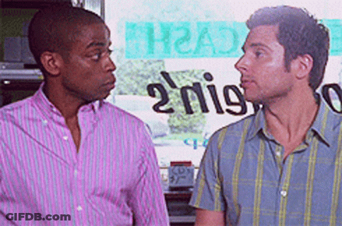 Two Men At Sign Saying 2 Nigs GIF