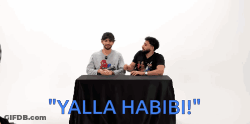 Two Men At Table Saying Yalla Habibi GIF