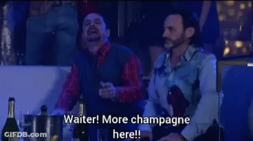 Two Men At Table With Champagne Saying Waiter More Champagne Here GIF