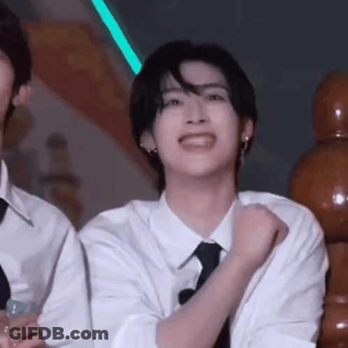 Two Men At Table With Chicken Rotisserie GIF