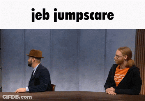 Two Men At Table With IEB Jumpscare GIF