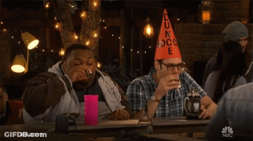 Two Men At Table With Orange Cone Saying Dun Rock GIF